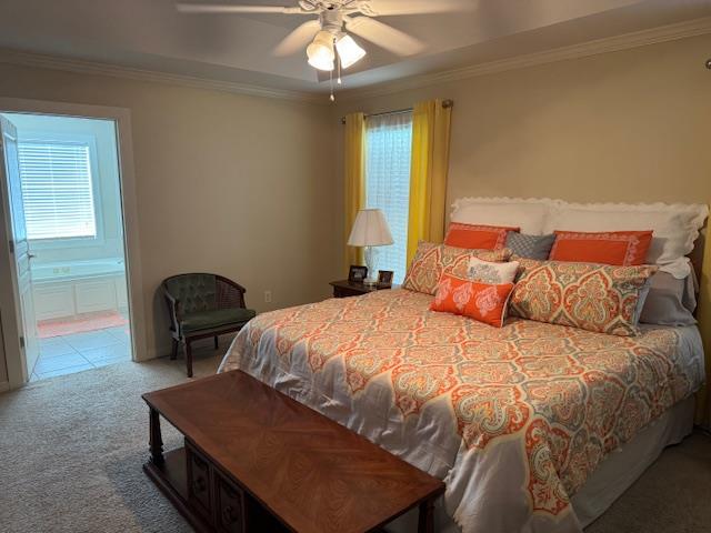 208 Craftsman Dr, Dothan, AL 36303 - carpeted bedroom featuring multiple windows, crown molding, connected bathroom, and a ceiling fan