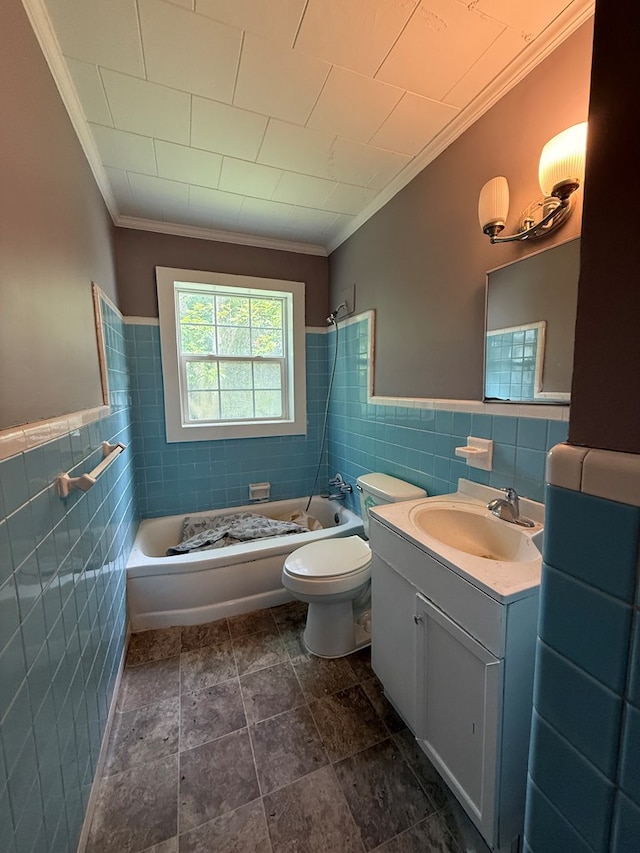 1028 S Bell St, Dothan, AL 36301 - full bath with tile walls, ornamental molding, vanity, toilet, and a wainscoted wall