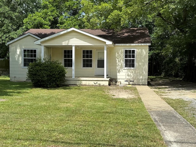 1028 S Bell St, Dothan, AL 36301 - view of front of house featuring a porch, crawl space, a front yard, and a shingled roof