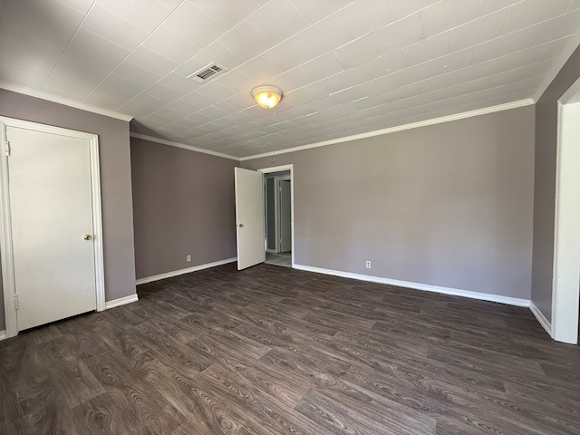 1028 S Bell St, Dothan, AL 36301 - empty room with ornamental molding, dark wood-style floors, and baseboards