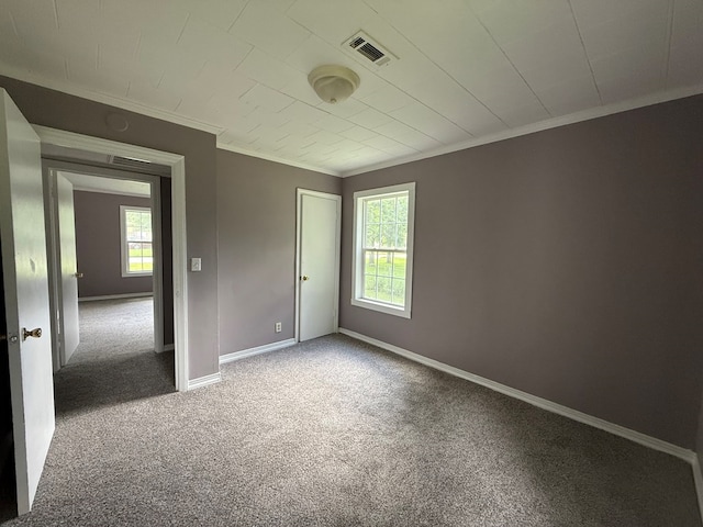 1028 S Bell St, Dothan, AL 36301 - empty room featuring crown molding, carpet flooring, and baseboards