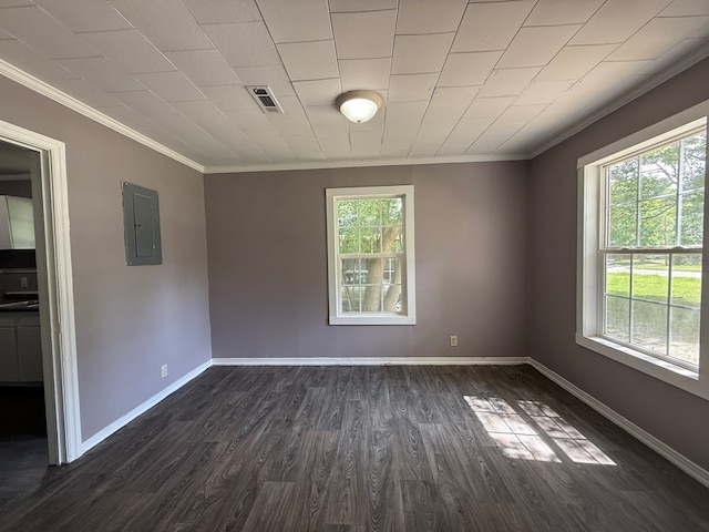 1028 S Bell St, Dothan, AL 36301 - empty room featuring ornamental molding, electric panel, dark wood finished floors, and baseboards