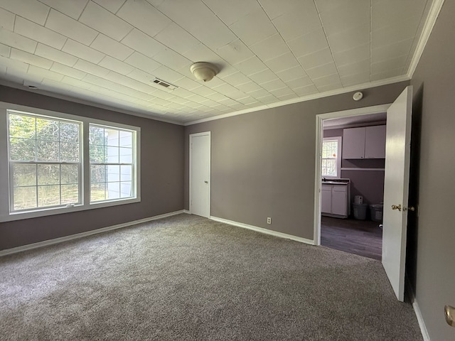 1028 S Bell St, Dothan, AL 36301 - unfurnished bedroom featuring crown molding, carpet, and baseboards