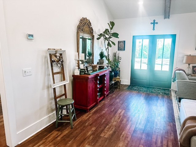 entryway with beam ceiling, dark hardwood / wood-style flooring, and french doors