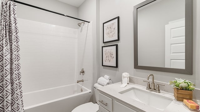 full bathroom featuring shower / tub combo, vanity, and toilet