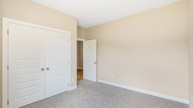 310 Heritage Way, Headland, AL 36345 - unfurnished bedroom featuring carpet floors, a closet, and baseboards