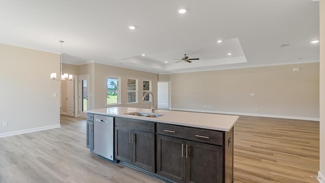 310 Heritage Way, Headland, AL 36345 - kitchen with dishwashing machine, light wood-style flooring, a sink, light countertops, and a raised ceiling