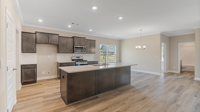 310 Heritage Way, Headland, AL 36345 - kitchen featuring light countertops, appliances with stainless steel finishes, light wood-style floors, a sink, and dark brown cabinets