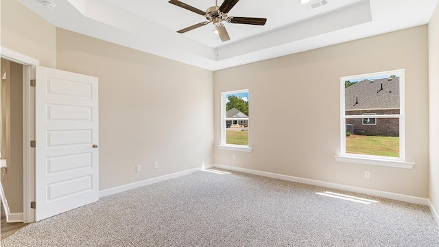 310 Heritage Way, Headland, AL 36345 - carpeted empty room featuring a tray ceiling, a ceiling fan, visible vents, and baseboards