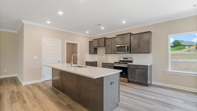 310 Heritage Way, Headland, AL 36345 - kitchen with crown molding, baseboards, stainless steel appliances, and a sink