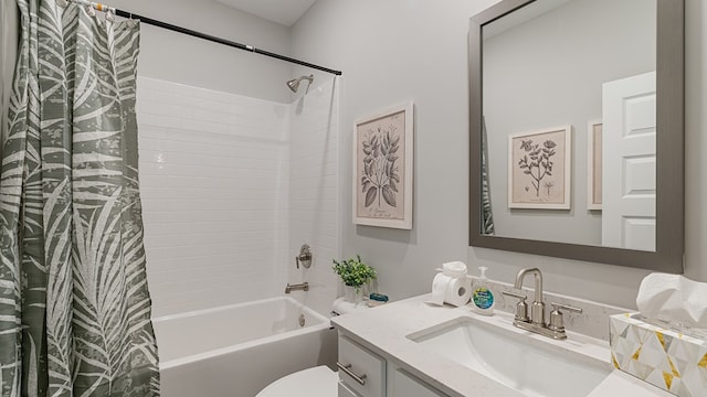 full bathroom featuring shower / tub combo with curtain, vanity, and toilet