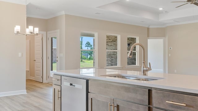 310 Heritage Way, Headland, AL 36345 - kitchen with a raised ceiling, light countertops, light wood-style flooring, stainless steel dishwasher, and a sink
