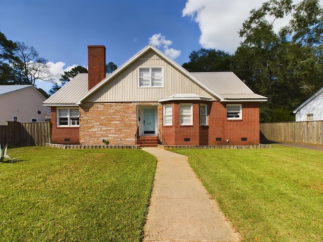 bungalow-style house featuring a chimney, brick siding, fence, crawl space, and a front yard