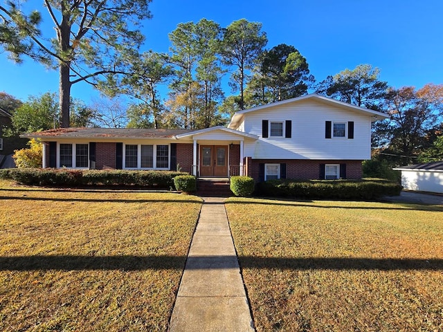 split level home with a front yard