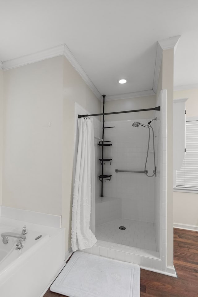 bathroom featuring crown molding, independent shower and bath, and hardwood / wood-style floors