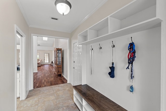 mudroom featuring ornamental molding