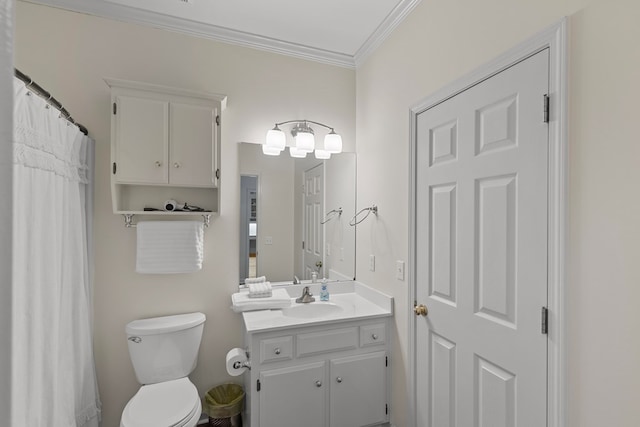 bathroom with toilet, ornamental molding, and vanity