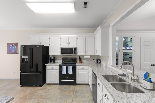 kitchen featuring black appliances, crown molding, light stone counters, sink, and white cabinetry