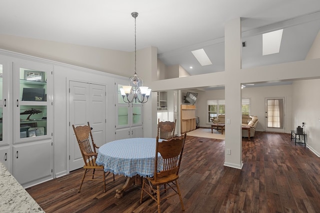 dining area featuring dark hardwood / wood-style flooring, an inviting chandelier, and high vaulted ceiling