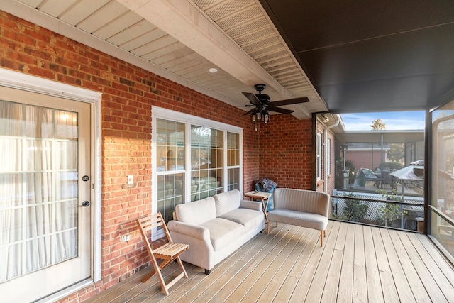 sunroom with ceiling fan