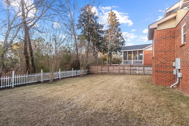 view of yard with a sunroom