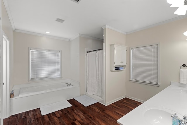 bathroom with hardwood / wood-style flooring, shower with separate bathtub, crown molding, and vanity