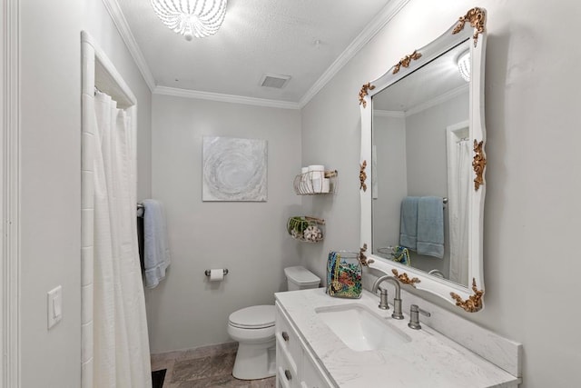 bathroom with vanity, toilet, ornamental molding, and a textured ceiling