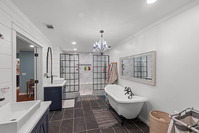 bathroom with a notable chandelier, separate shower and tub, tile patterned floors, vanity, and ornamental molding