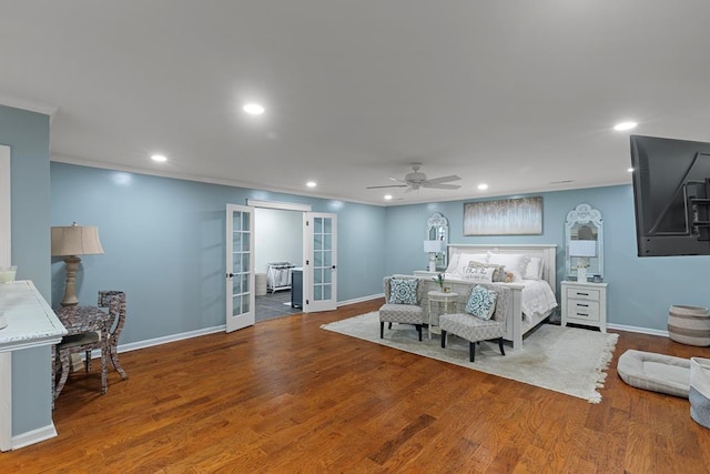 bedroom with french doors, ceiling fan, crown molding, and hardwood / wood-style floors