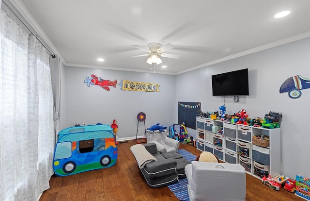 game room featuring ceiling fan, crown molding, and dark wood-type flooring