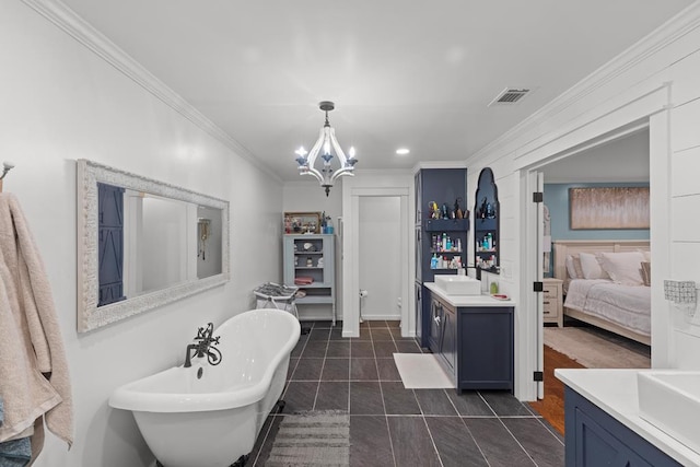 bathroom with a tub, a notable chandelier, tile patterned floors, crown molding, and vanity