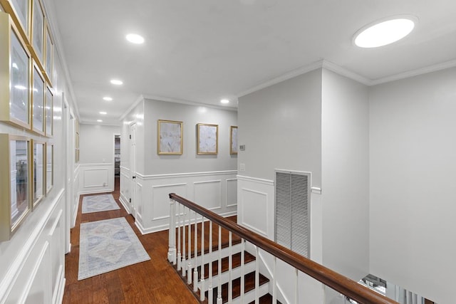 hallway with crown molding and dark wood-type flooring