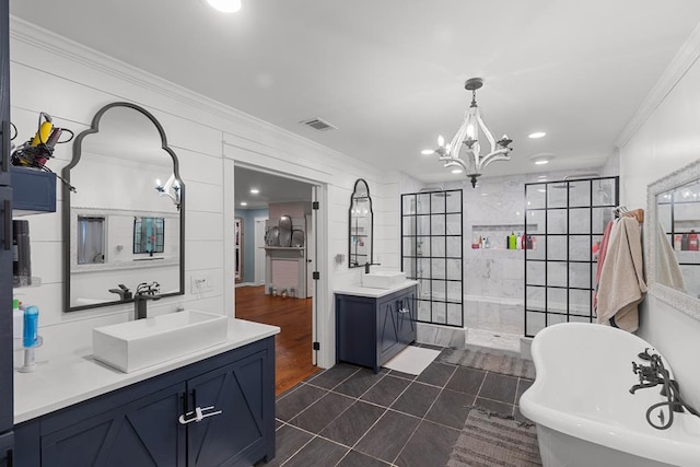 bathroom with vanity, crown molding, tile patterned flooring, separate shower and tub, and a notable chandelier