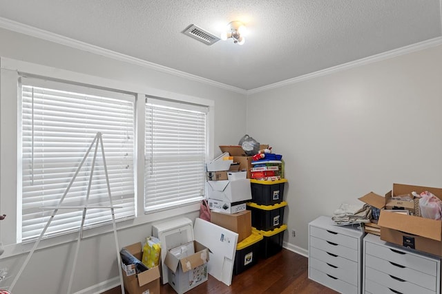 interior space with crown molding, dark wood-type flooring, and a textured ceiling