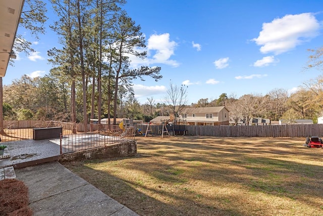 view of yard featuring a patio and a playground