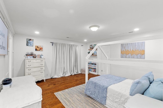 bedroom with hardwood / wood-style floors