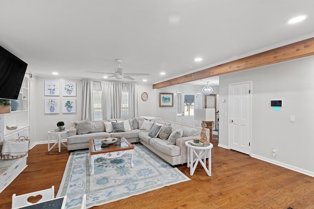 living room with wood-type flooring and ceiling fan