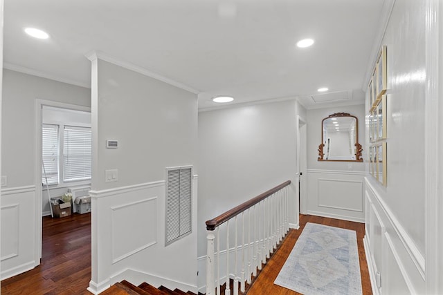 corridor with dark hardwood / wood-style flooring and crown molding