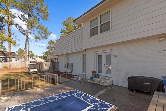 back of house with french doors and a patio