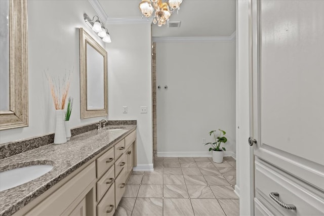 bathroom with an inviting chandelier, double vanity, visible vents, a sink, and crown molding