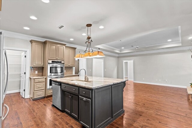 kitchen featuring a sink, recessed lighting, a ceiling fan, crown molding, and appliances with stainless steel finishes
