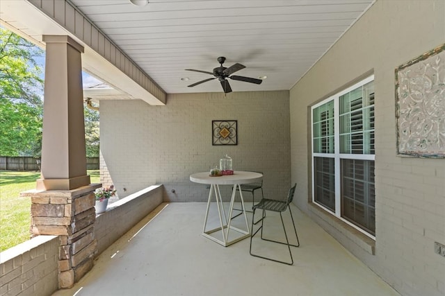 view of patio featuring a ceiling fan and fence