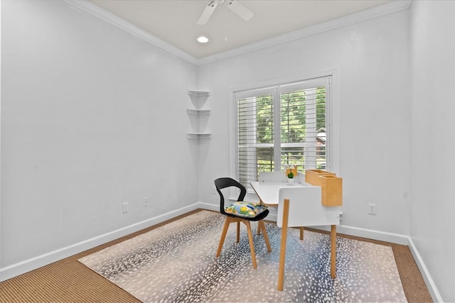 living area with ceiling fan, baseboards, and ornamental molding