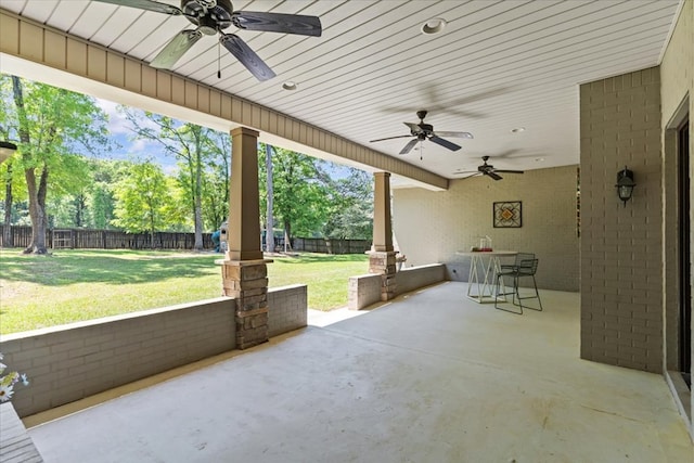 view of patio featuring outdoor dining area, a fenced backyard, and ceiling fan