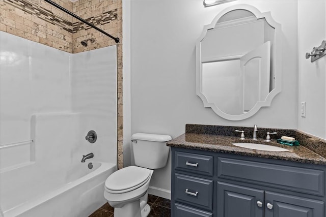 bathroom with shower / bathing tub combination, baseboards, toilet, and vanity