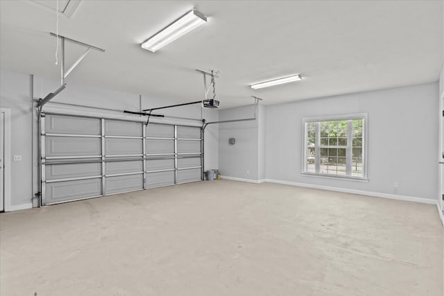 garage featuring baseboards and a garage door opener