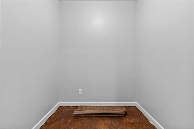 unfurnished room featuring baseboards