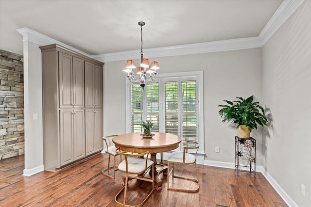 dining room featuring hardwood / wood-style flooring, baseboards, a chandelier, and ornamental molding
