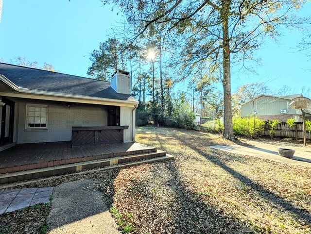 view of yard with a wooden deck