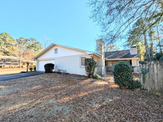 view of side of home featuring a garage